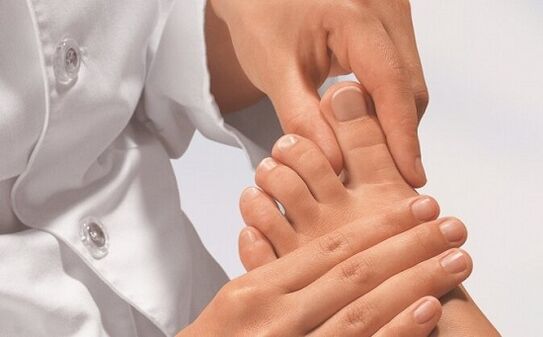 specialist examines feet for fungal infection